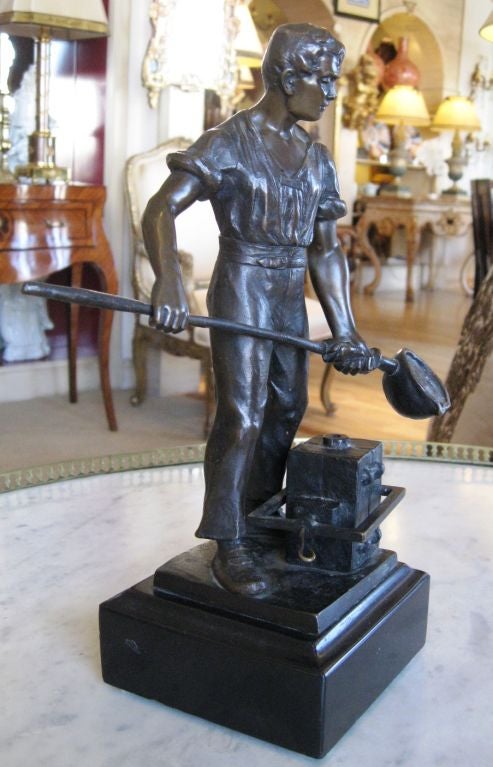 An interesting and intricate bronze sculpture of a metalworker on a black marble base. It is signed and is made by Echte Bronze which was known for its depiction of the working man. It was made in Schmalenberg, Germany. Echte bronzes were made from