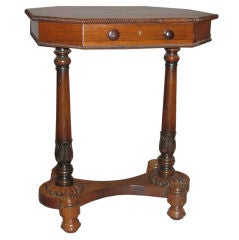 A Gillows of Lancaster rosewood and yew wood octagonal worktable