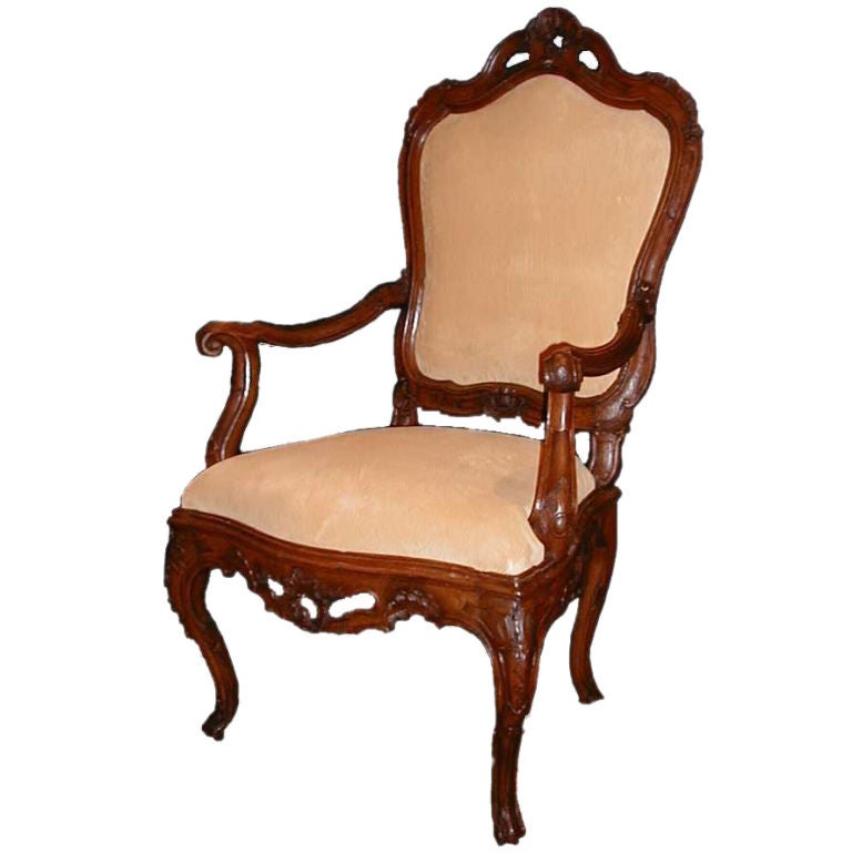 A large walnut carved openwork armchair For Sale
