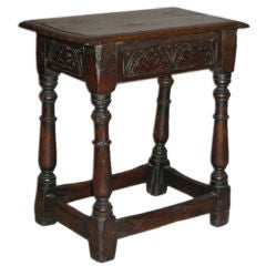 A carved oak joint stool
