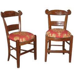 A set of five chairs with carved eagle heads