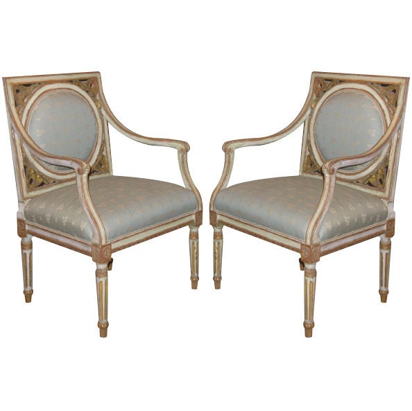 A Pair of Painted and Gilded Neoclassical Chairs For Sale