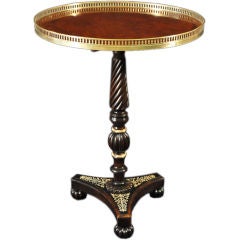 A Regency Burr Yew, Ebonised Andivory Inlaid Tripod Table
