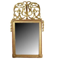 Louis XVI carved and giltwood mirror