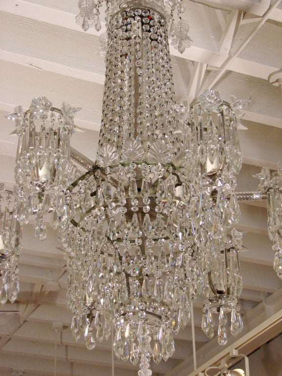 A fine English cut crystal Regency style six-arm chandelier with six additional internal lights, circa 1840-1860.  Now electrified.