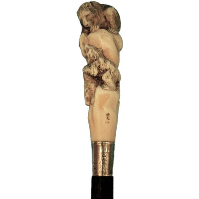 A signed Japanese carved ivory silver mounted cane