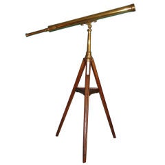 Antique English brass telescope on tripod.