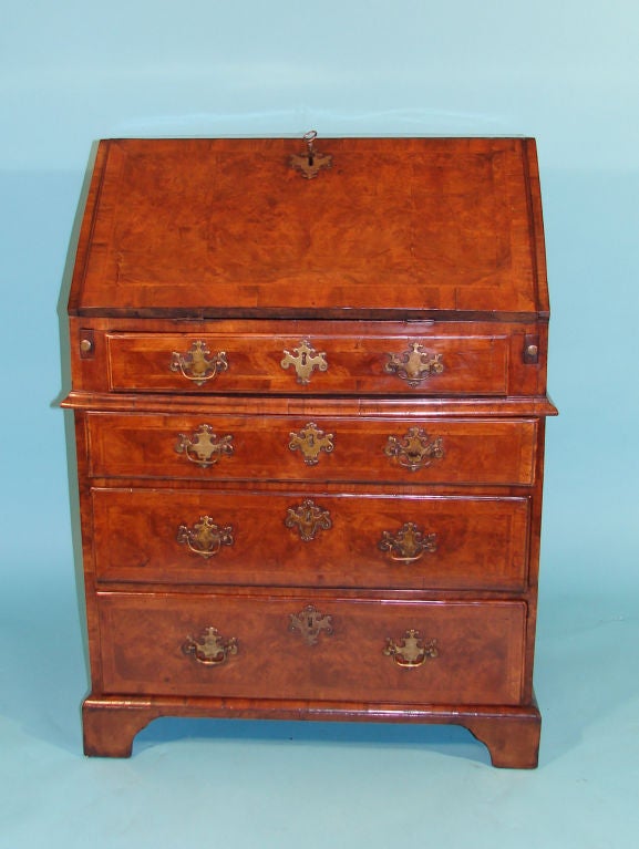 George II period walnut slant front bureau of small size.