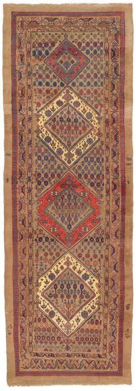 Bidjar carpets vary between very recognizable workshop production and interesting pieces made in smaller village workshops. This would be the latter. It is unusual to have a camel colored ground in a Bidjar. Note the experimentation with Folk Art in