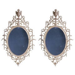 A Pair of Large Oval Carton-Pierre Mirrors