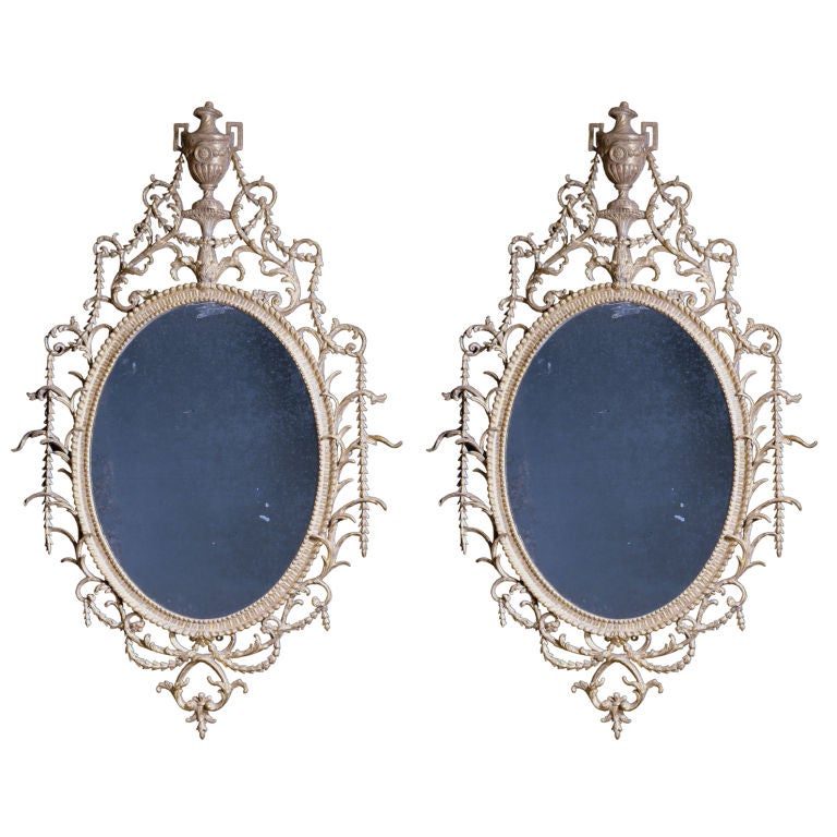 A Pair of Large Oval Carton-Pierre Mirrors