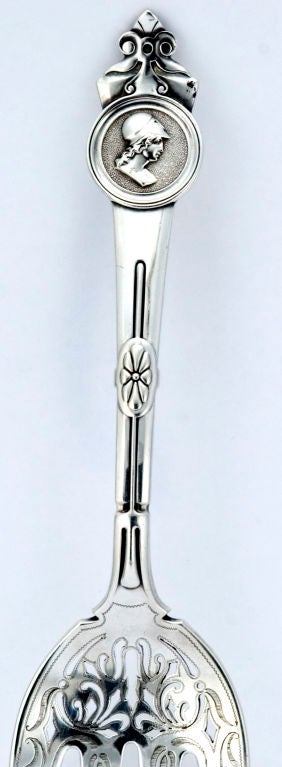 PLEASE VISIT LAUREN STANLEY IN NEW YORK<br />
<br />
A fine circa 1870 sterling silver meat fork by Gorham for Tiffany & Co.,  in the medallion motif, with four (4) trident like prongs, above the prongs magnificent piercing by hand, tong tines