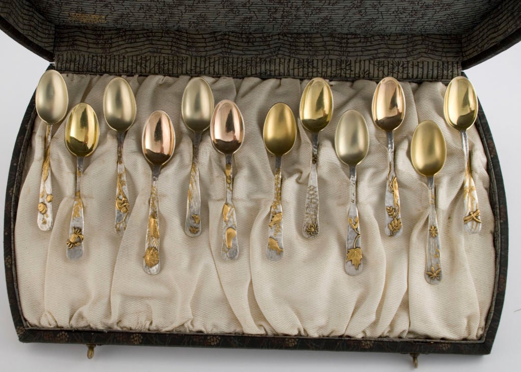 PLEASE VISIT LAUREN STANLEY IN NEW YORK<br />
<br />
A fine set of twelve (12) circa 1880 applied lap over edge demitasse spoons by Tiffany & Co., of New York, the background hand hammered, with applied elements that include fish, crab, shells,