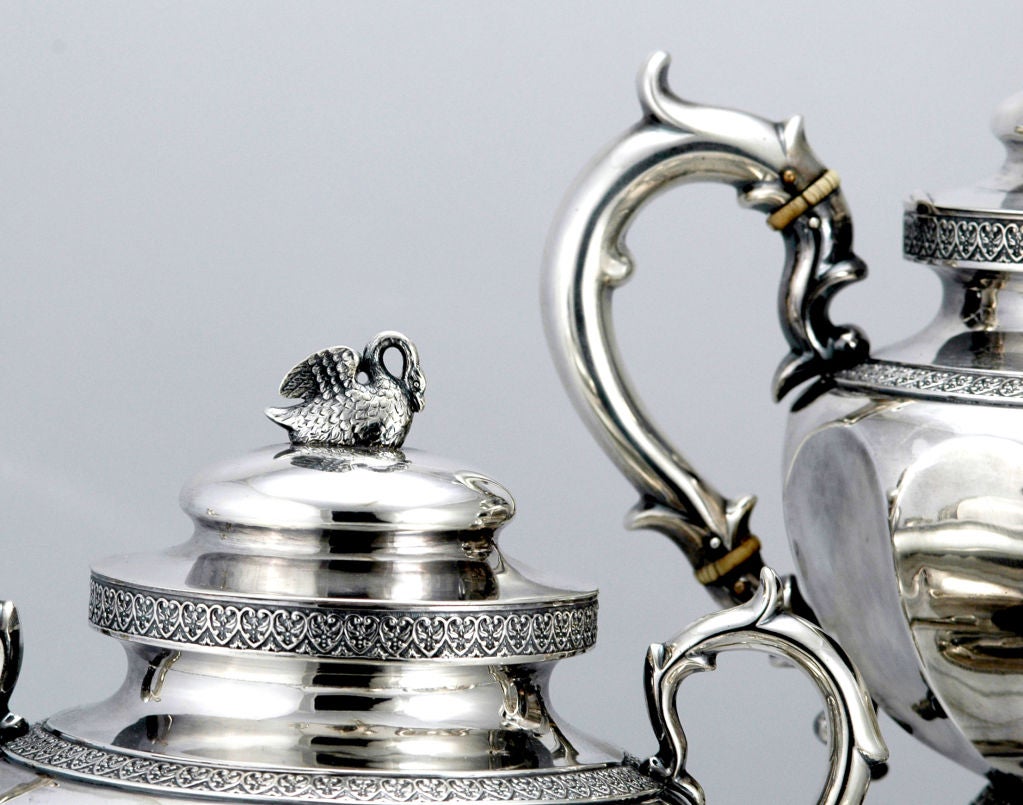 PLEASE VISIT LAUREN STANLEY IN NEW YORK<br />
<br />
A fine circa 1860 coin silver four (4) piece coffee - tea set by Nicholas J. Bogert, of Newburgh, New York, each 12-sided piece with applied die rolled borders at various levels, with S scroll