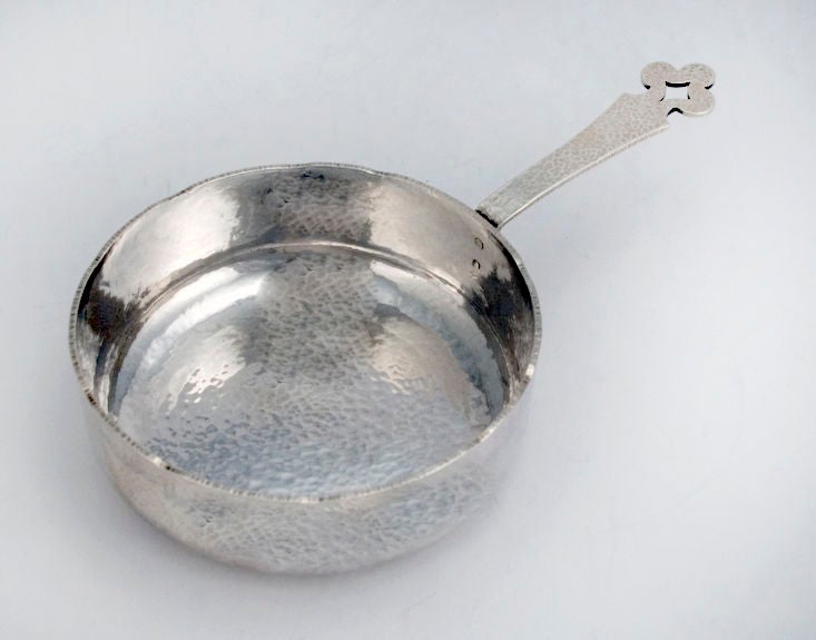 an exceedingly rare circa 1882 sauce pan by Dominick & Haff, of New York, the entired boy hand <br />
hammered, with applied, pierced trefoil ended handle.  Originally in 1882, this piece was used to heat sauce at the table, but now could be used