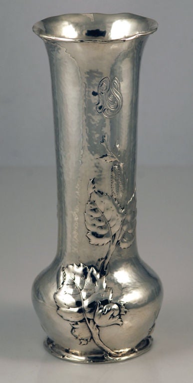 A sterling silver vase by Gorham of Providence, RI, a one-of-a-kind prototype, made 27 November 1908, chased on both sides with leaves and cattails on a hammered background, with applied branches at base and upper lip.
Weight 24 oz. Height 11 15/16
