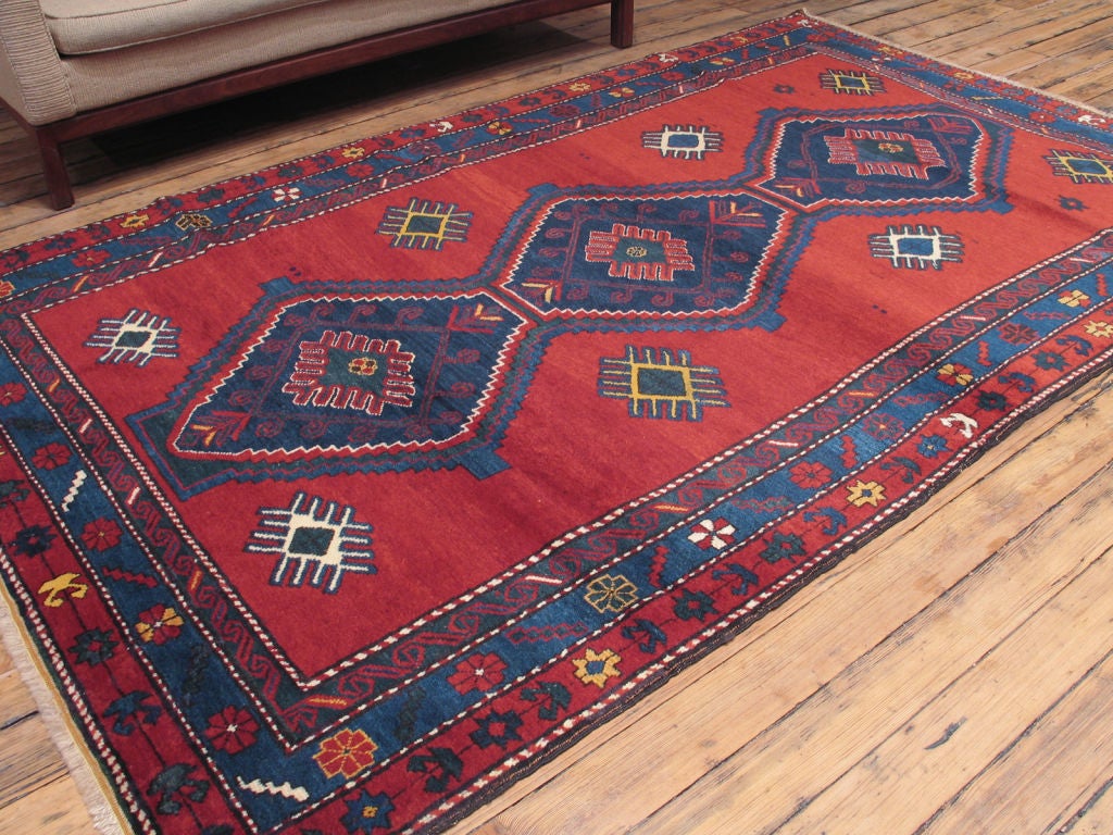 Kazak rug with vibrant colors and bold design from the Caucasian mountains.