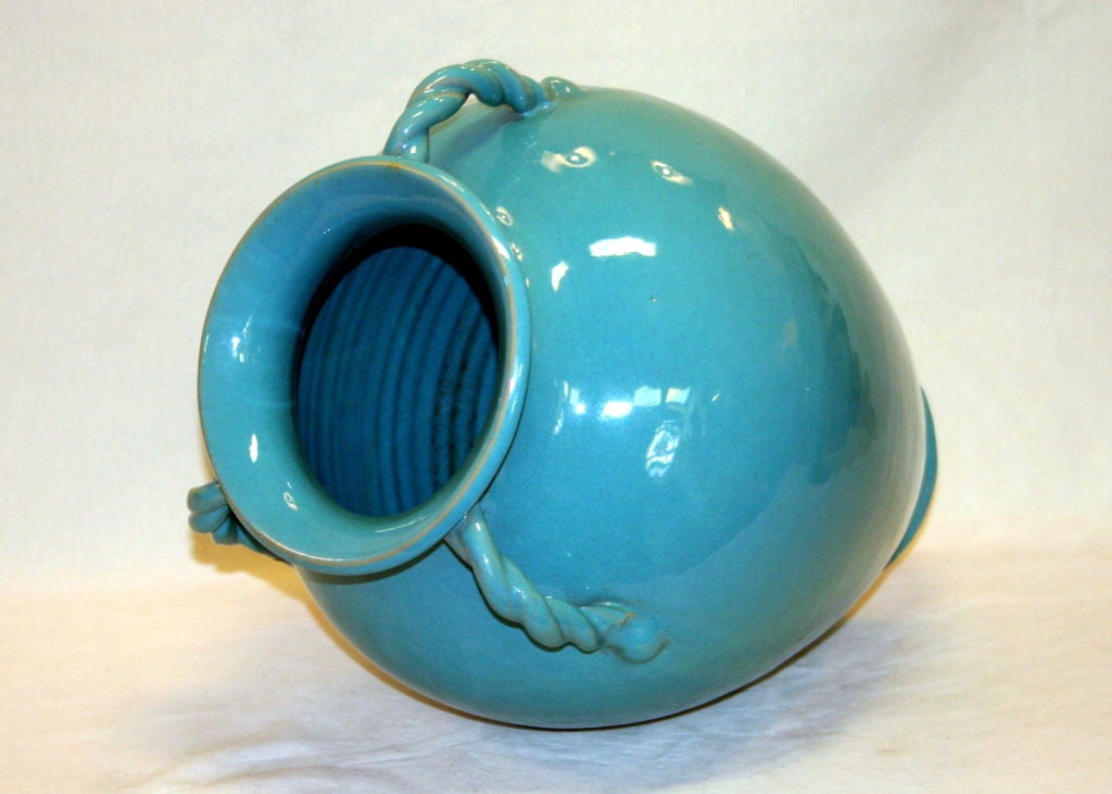 Great vase from the Royal Crown Pottery of North Carolina. Large, full form vase with three rope twist handles echoing lines of the graceful body. Beautiful and even turquoise glaze with faint crackle pattern and subtle variation. Circa 1940. 16