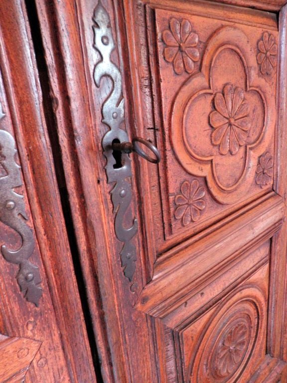 Gorgeous Chestnut Armoire. Intricate carved rosette detail.<br />
Hinges are in great working condition, as is lock and key. Inside, there is tons of a space and a working drawer.