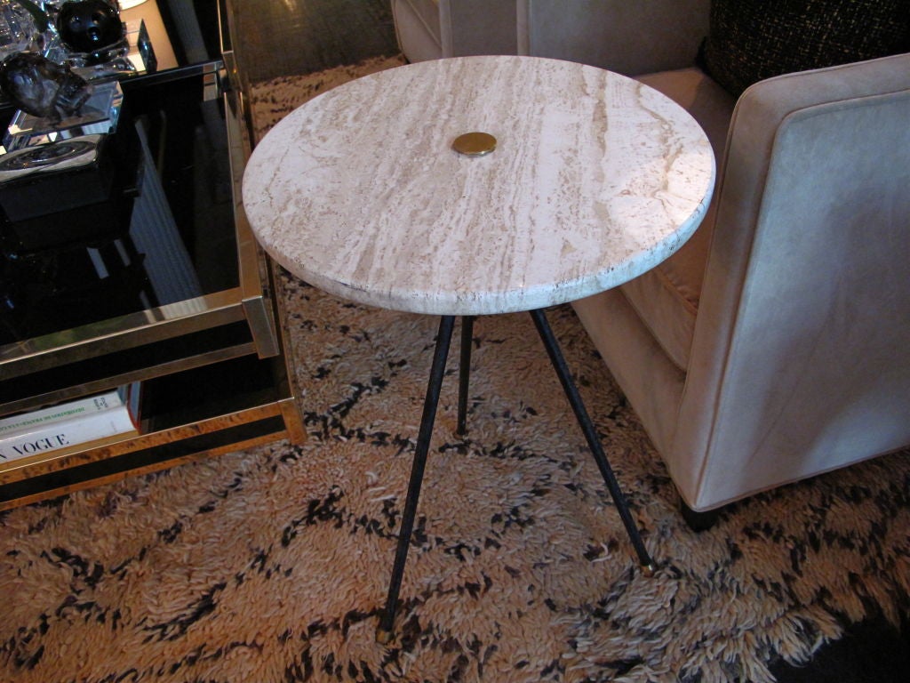 Vintage Italian side table with black met and brass tripod base and round travertine top.
