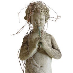Garden Statue of Child Playing Flute