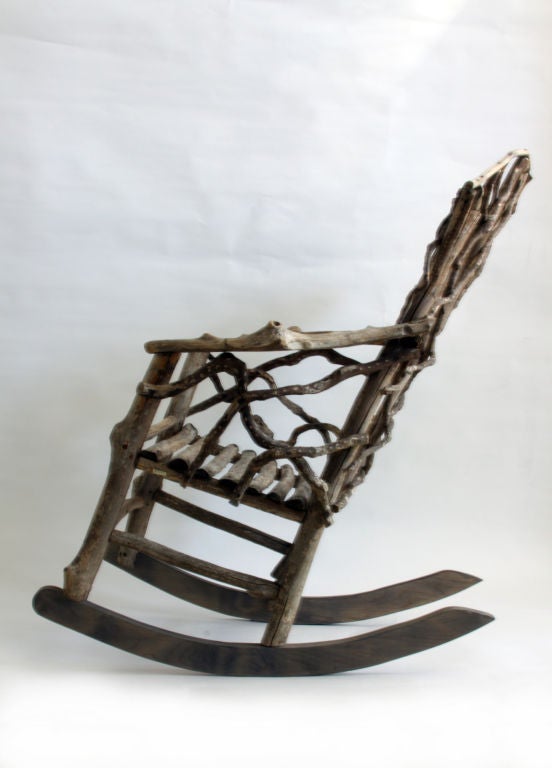 The very organic design and materials of this rocking chair make it a one-of-a-kind, interesting addition to any space - indoors or out.  Seat depth is 22 inches.