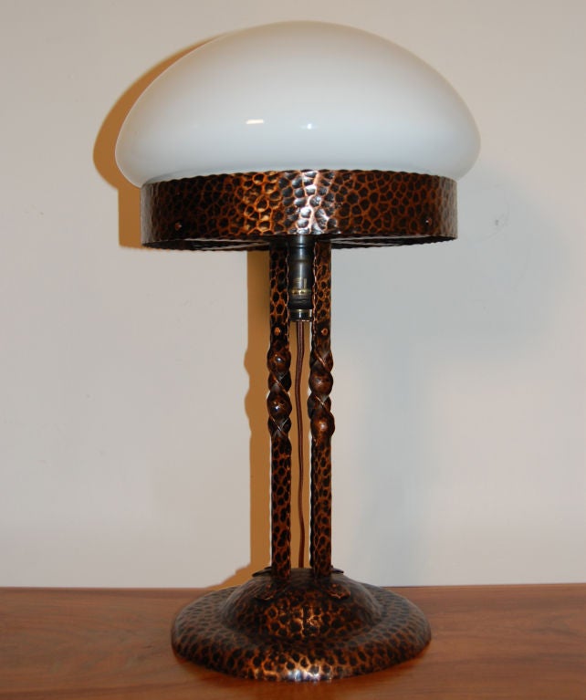 Handsome hammered copper table lamp with white glass globe. Referred to in Sweden as a 