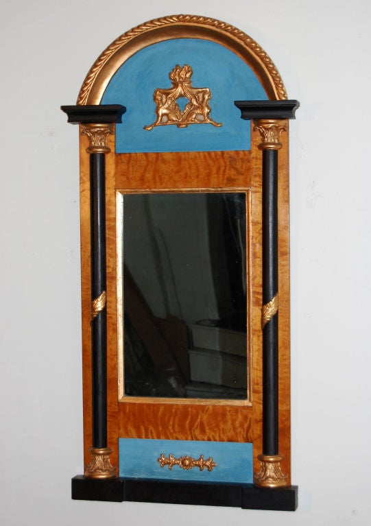 Period Empire mirror in exceptional condition of golden flame birch, carved and painted and gilded wood and gesso.  Swedish blue paint, gilding and black paint is vintage, but possibly not original.  Silvered mirror is also antique, but may not be