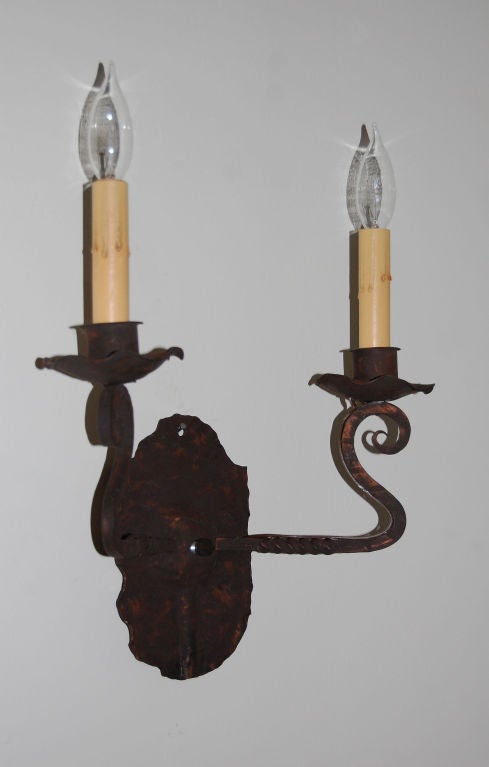 Hand-wrought iron sconce with two candleholders.  Originally for candlelight only, they have been electrified and re-wired to US standards.  <br />
<br />
Can be used as a pair with our Reference #407NA113, although slightly different (sold