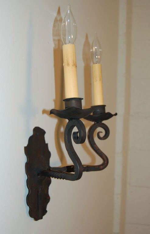 Hand-wrought iron sconce with two candleholders.  Originally for candlelight only, they have been electrified and re-wired to US standards.  <br />
<br />
Can be used as a pair with our Reference #N165, although slightly different (sold