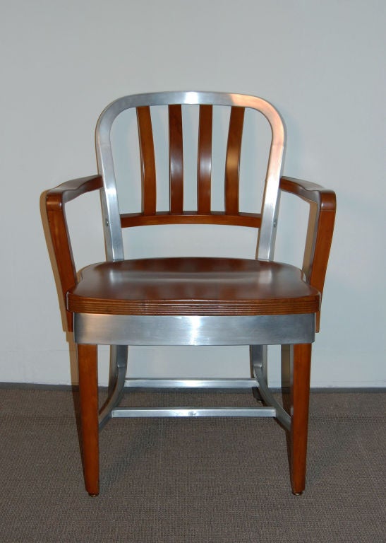 Model No. 8312 Shaw Walker arm chair with wooden seat, legs, arms, wooden slat back and aluminum trim. Completely restored<br />
<br />
Overall Dimensions: 24