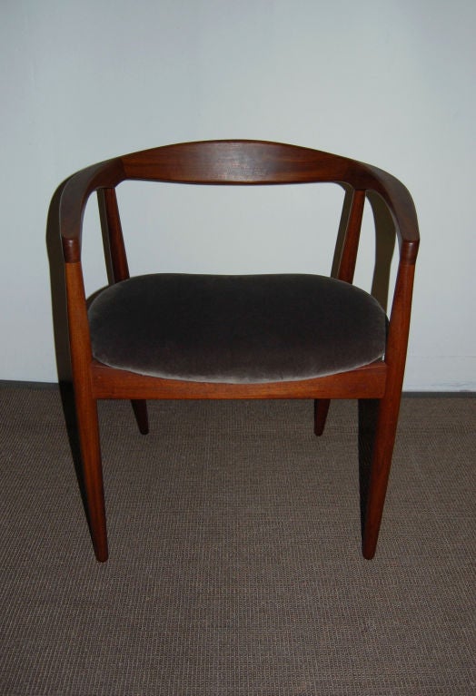 Sculptural arm chair of natural teak.  Seat is newly padded and reupholstered in commercial grade steel gray cotton velvet.  This looks like a Hans Wegner armchair but we have been unable to substantiate it.<br />
<br />
Overall Dimensions: 24