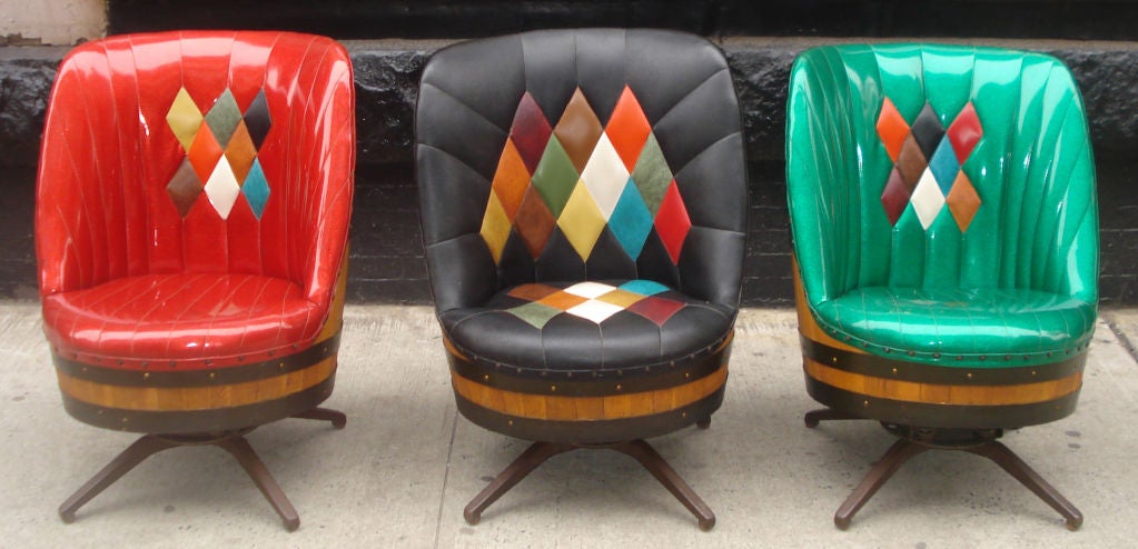 3 Spectacular 1960's Barrel Chairs mounted on metal bases with balancing springs. Black chair is leather, the green & red are vinyl with glitter.