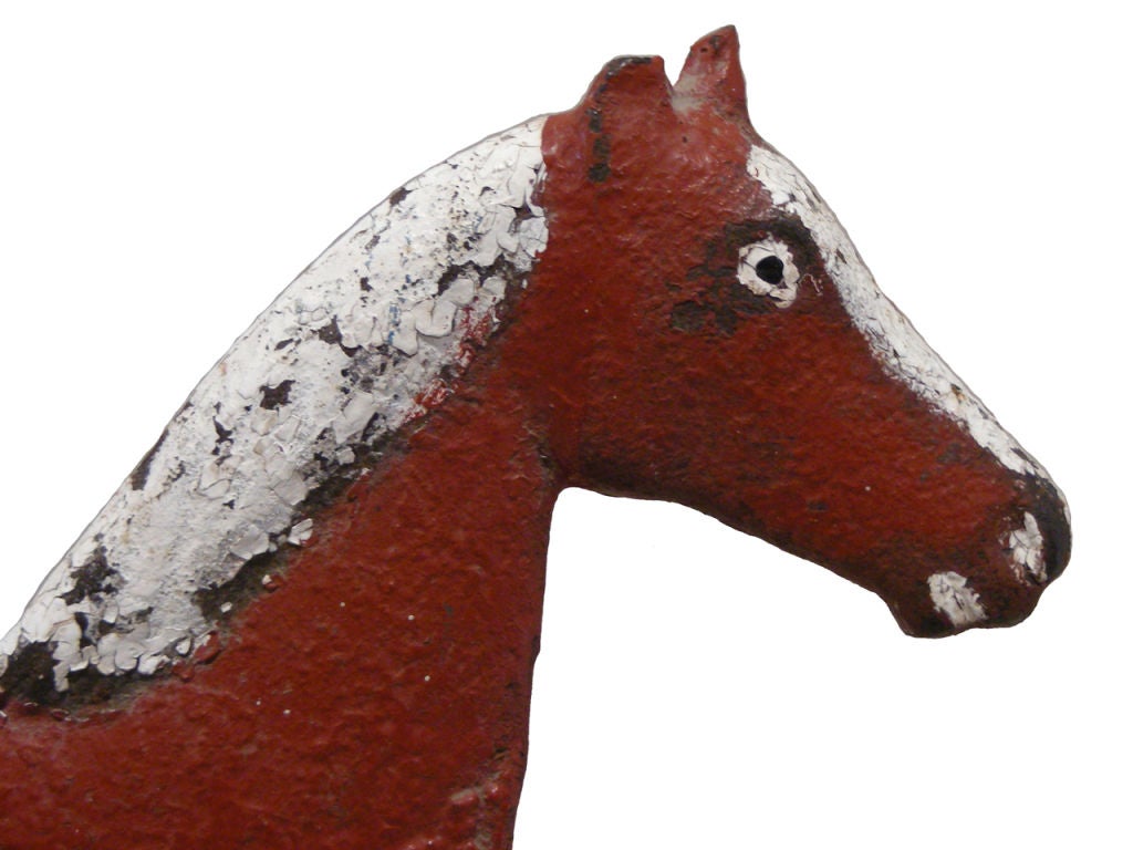 Circa 1900 cast iron windmill weight in the longtail horse form made by Dempster, on a double stepped brick base, in the best age cracked red and white paint, as found surface, condition
