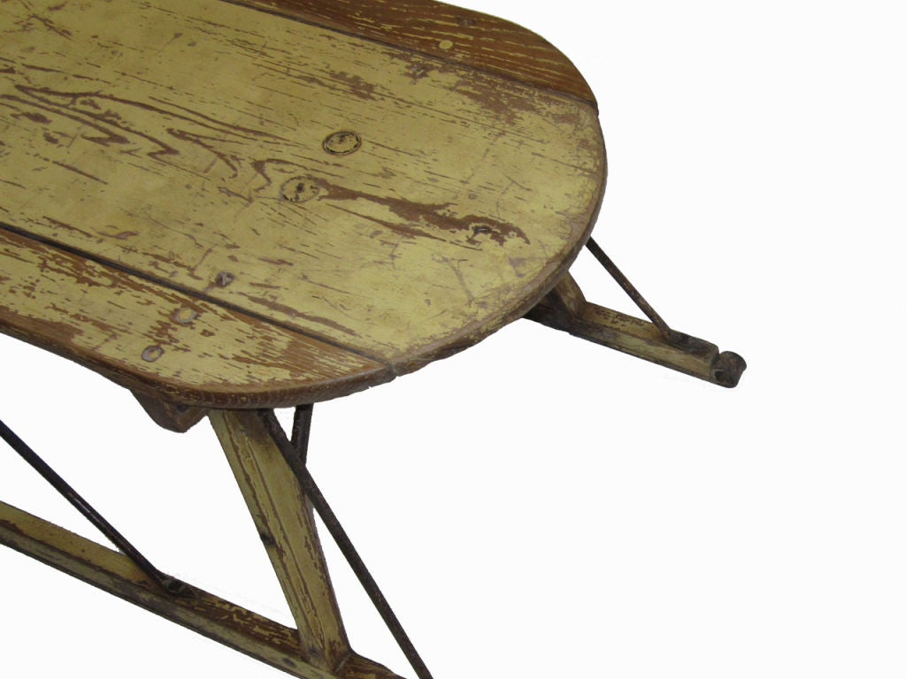 Circa 1900 horse drawn sled with iron bracing and runners, all in first surface pale yellow paint
