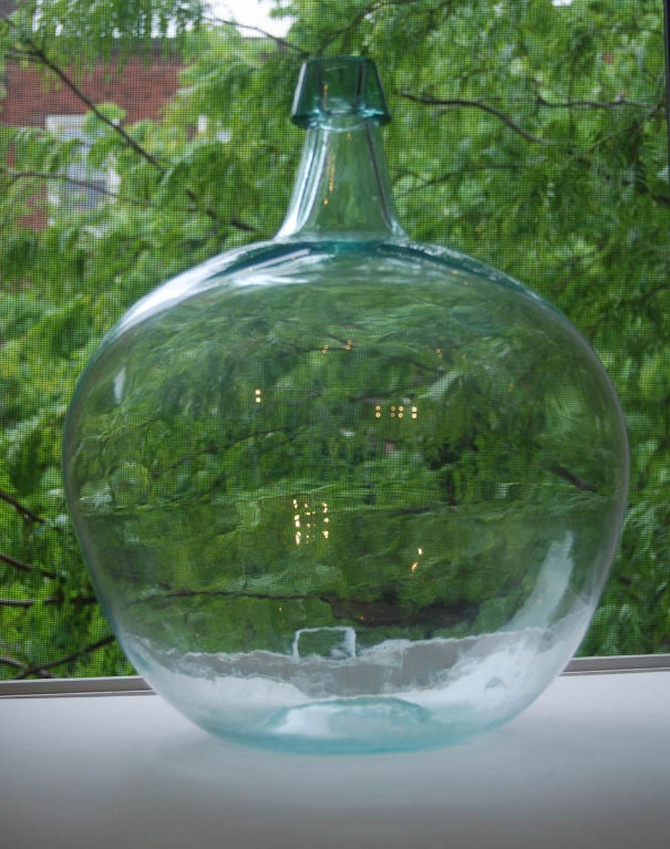Outstanding and bulbous demijohn bottle, hand-blown from aquamarine window glass; 2nd half 19th century American.