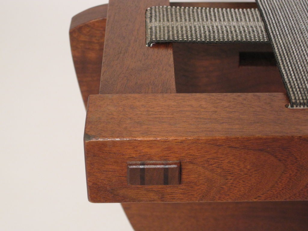 A beautiful example of Nakashima's work.Large Butterfly cross stretcher base supporting a Walnut mortise and tennon platform.<br />
The Greenrock is a perfect piece of furniture. Great choice of Walnut used in this piece. (Footstool comes with