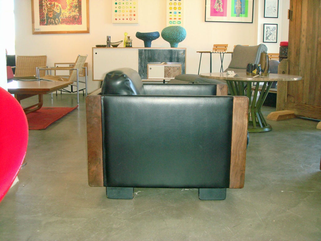 A pair of smaller scale Italian club chairs. Cassina label is dated 1968. Very nice original condition.