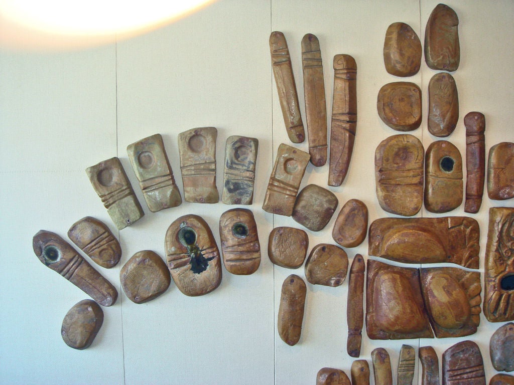 From the Palm Springs residence of designer Steve Chase circa 1976. Originally placed on an exterior entryway wall adjacent to the swimming pool. 79 hand built ceramic pieces have been attached to burlap covered boards for interior display. They can