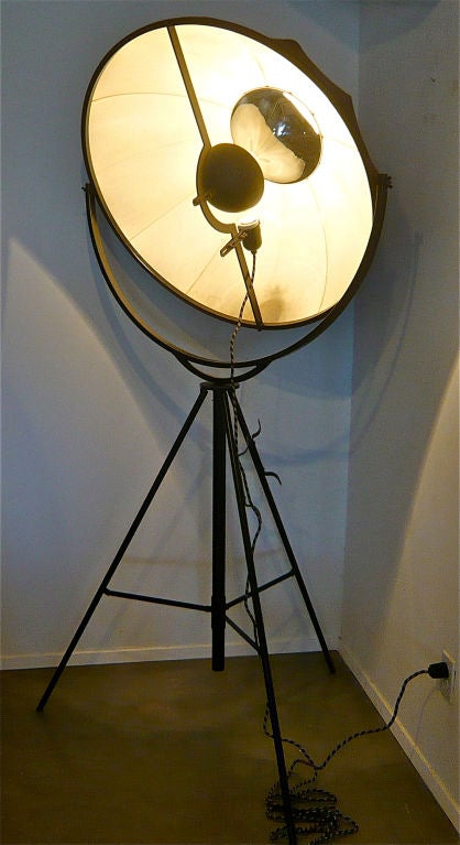 INSPIRED BY THE ICONIC REFLECTIVE STAGE LIGHT INVENTED BY FORTUNY IN 1907.TELESCOPIC WITH 360 DEGREE SHADE SWIVEL AND TILT CAPACITY.THE SHADE DIFFUSES AND REFLECTS A WARM GLOW DIRECTLY OR INDIRECTLY.HARDWARE,PATINA AND DIMENSIONS DATE THIS LAMP