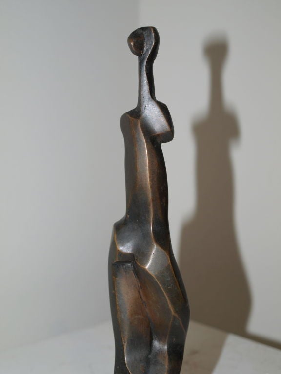 Unquestionably one of the more exquisite examples of Cubism, artfully created with strong lines depicting the human form.   Artist: Elena Laveron (Madrid, Spain) created this bronze sculpture which is titled: “Mujer de pie”, meaning “Woman