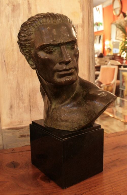 Striking French Art Deco period bronze bust of Jean Mermoz mounted on black marble base.