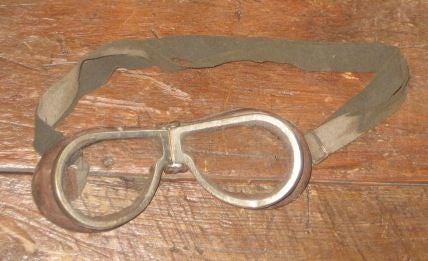 Vintage leather motorcycle goggles from the 1940's. Goggles bend at the nose and have an adjustable head strap.