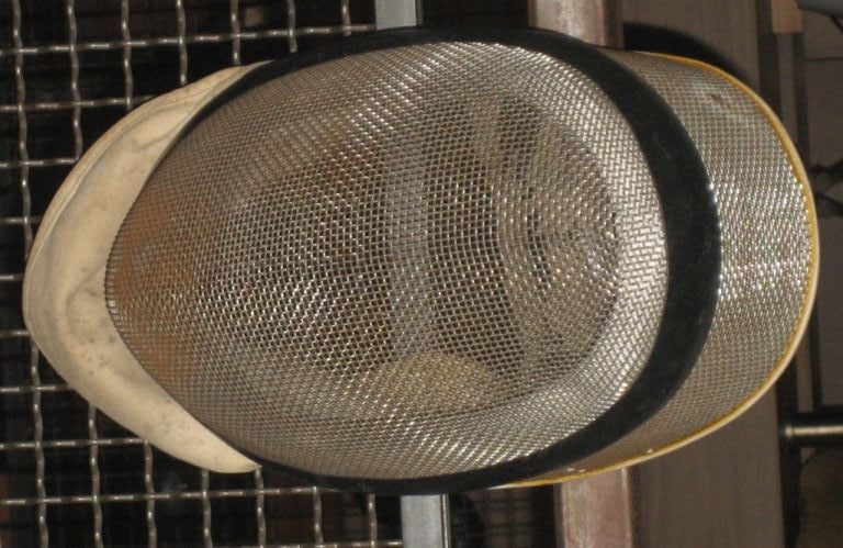 Vintage Fencing masks from the 1940's from Belgium. Each mask is slightly unique and has wire mesh front and cloth neck lining. (Each sold separately)