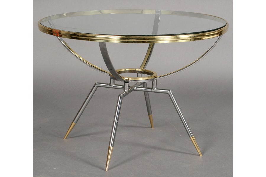 Chic mid-century modern steel and brass coffee table with inset glass top and flared pencil point legs.