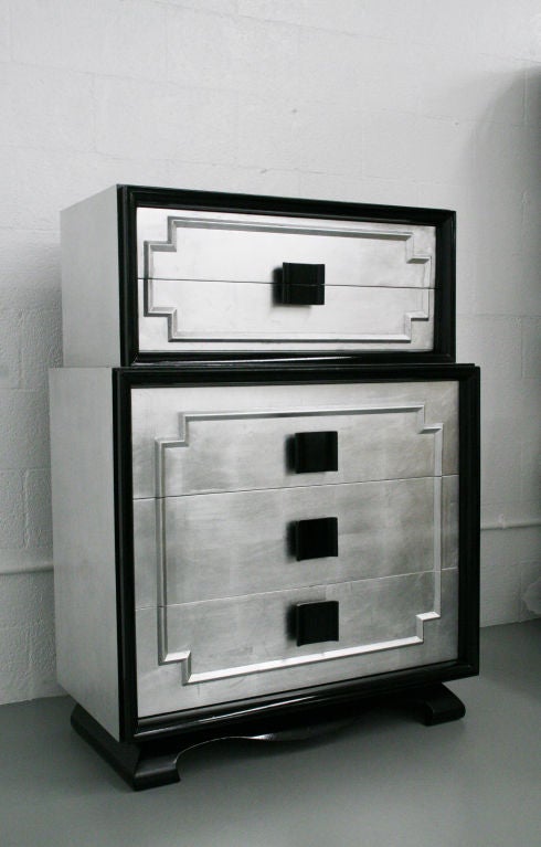 Rare tall Kittinger chest of drawers of drawers, c. 1940's, USA. Asian modern design, high quality construction, very well built and solid. Made entirely of oak wood, newly silver leafed, and black lacquered sculptural asian style bases, and handle