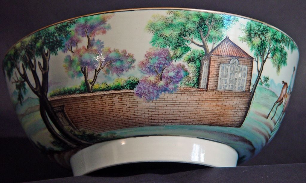 An extremely rare hunting punchbowl, painted with a continuous scene of a hunt meeting after an engraving by PC Canot, following a painting by James Seymour, the inner rim with a border of flowers and a central image of a single huntsman on