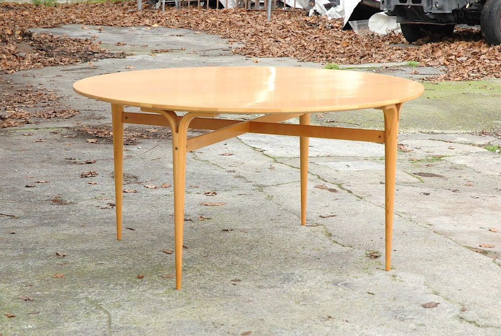 More recent production example of 1948 Mathsson design.
Large round table encapsulates Mathsson's unique ability to combine exceptional sturdiness with delicate beauty.  Generous leg room afforded by skirtless top, saber thin legs situated away