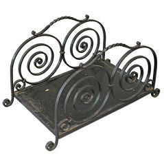 Antique 1920
s Log Holder with Striking Spiral Ironwork