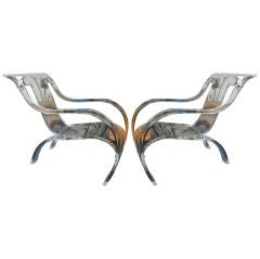A pair of perspex lounge chairs attributed to Gerald Summers